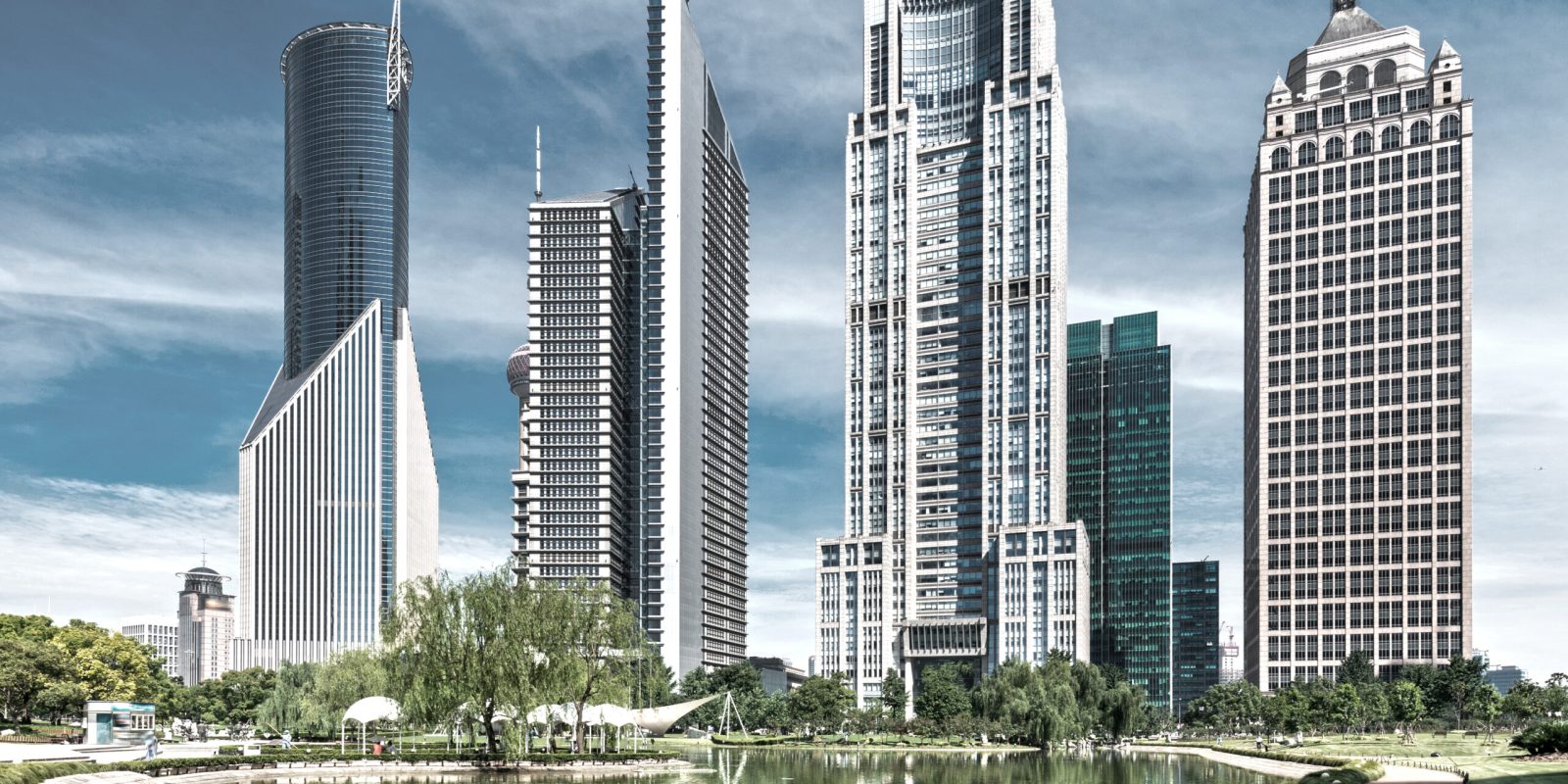 park and skyscrapers under the blue sky in shanghai